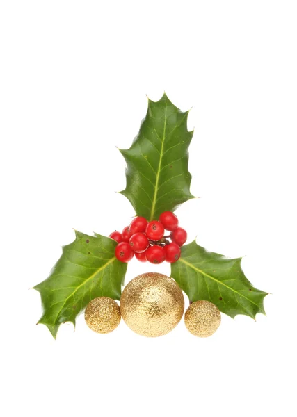 Sprig of holly with baubles — Stock Photo, Image