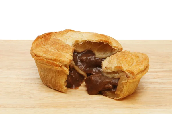 Steak pie on a board — Stock Photo, Image