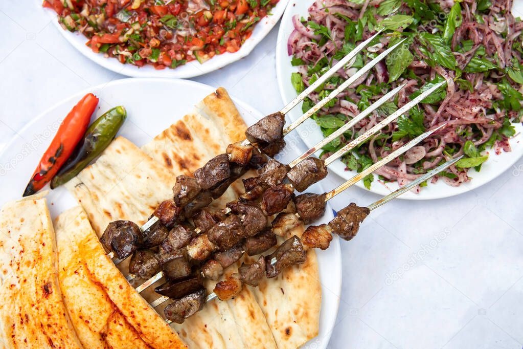 Traditional Turkish grilled liver shish kebab or barbecued shashlik meat.