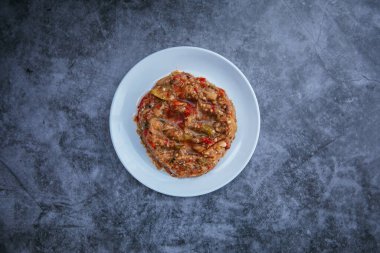 Traditional Turkish or Greek eggplant meze or appetizer on black background.