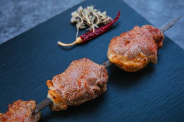 Skewers of grilled shish kebab or barbecued shashlik meat.