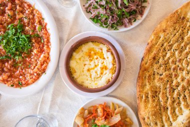 Traditional Turkish or middle eastern appetizer meze humus or hummus plate on the table in the restaurant
