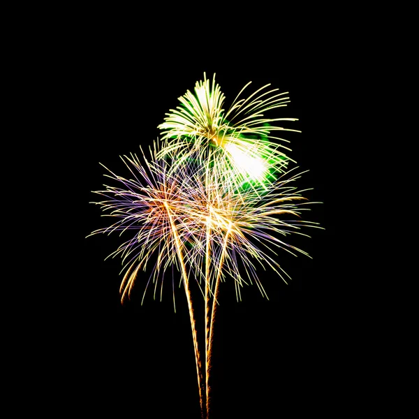 Colorful fireworks over dark sky background — Stock Photo, Image