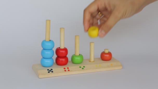 Demonstration of colorful backgammon wooden toy — Stock Video