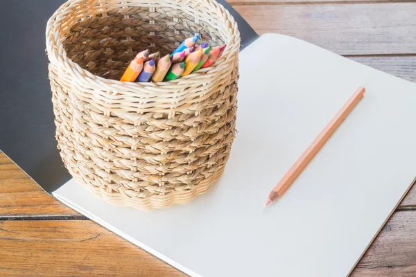 Art paper book and many different colored pencils — Stock Photo, Image