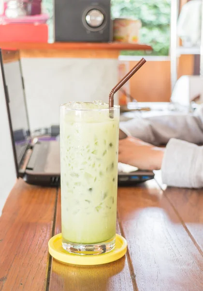 Glass of iced green tea latte — Stock Photo, Image