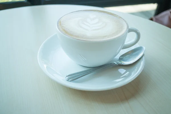 Hot cup of coffee latte — Stock Photo, Image