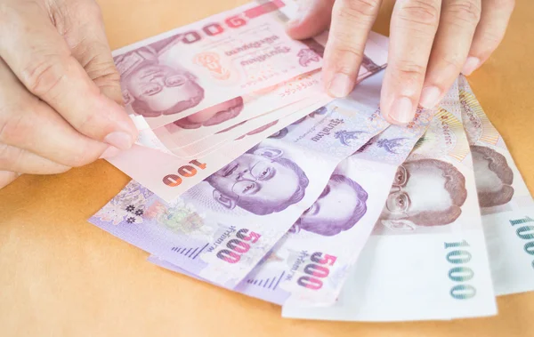 Man hand counting Thai baht banknote — Stock Photo, Image