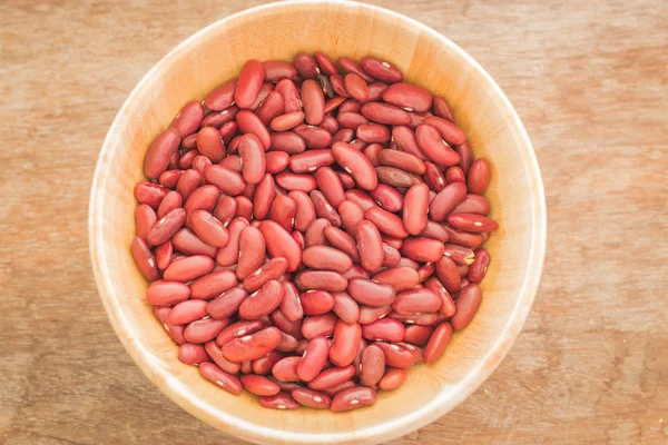 Raw red kidney bean in wooden bowl — Stock Photo, Image
