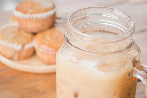Banana muffins and iced coffee — Stock Photo, Image