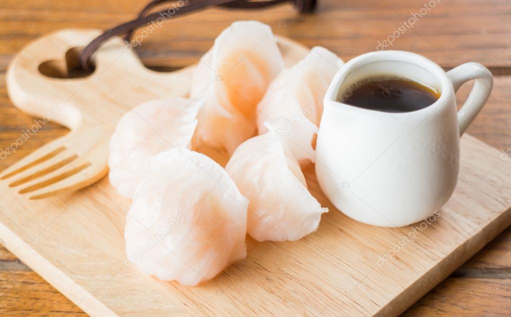 Chinese har gao dim sum dumplings on wooden plate