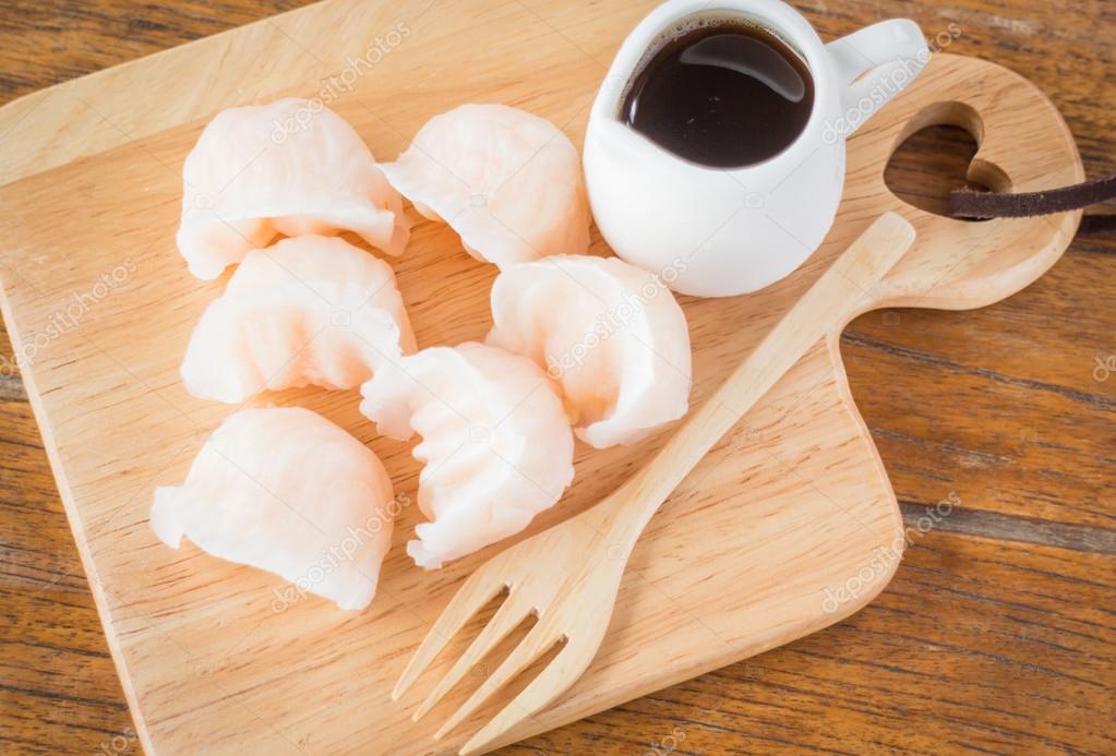 Chinese har gao dim sum dumplings on wooden plate