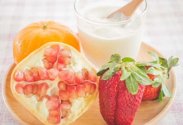 Glass of yogurt with fresh mix fruit — Stock Photo, Image