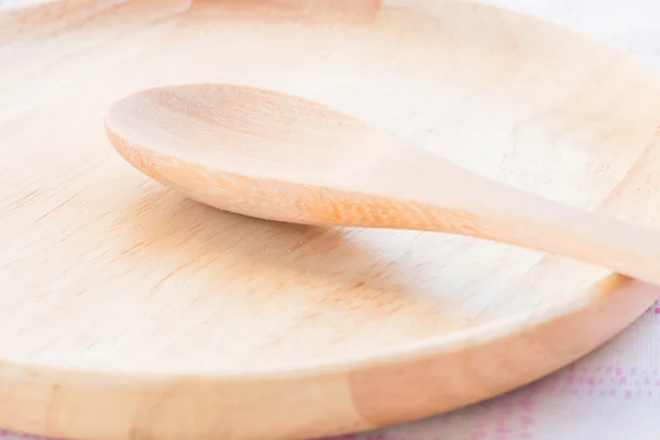 Set of wooden spoon and plate — Stock Photo, Image