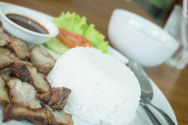 Spicy grilled pork with rice dish — Stock Photo, Image