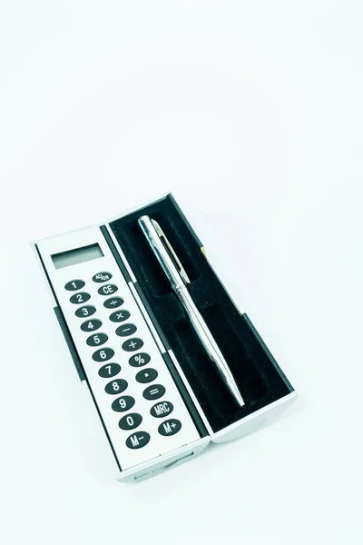 Pocket box of calculator and pen isolated on white background — Stock Photo, Image