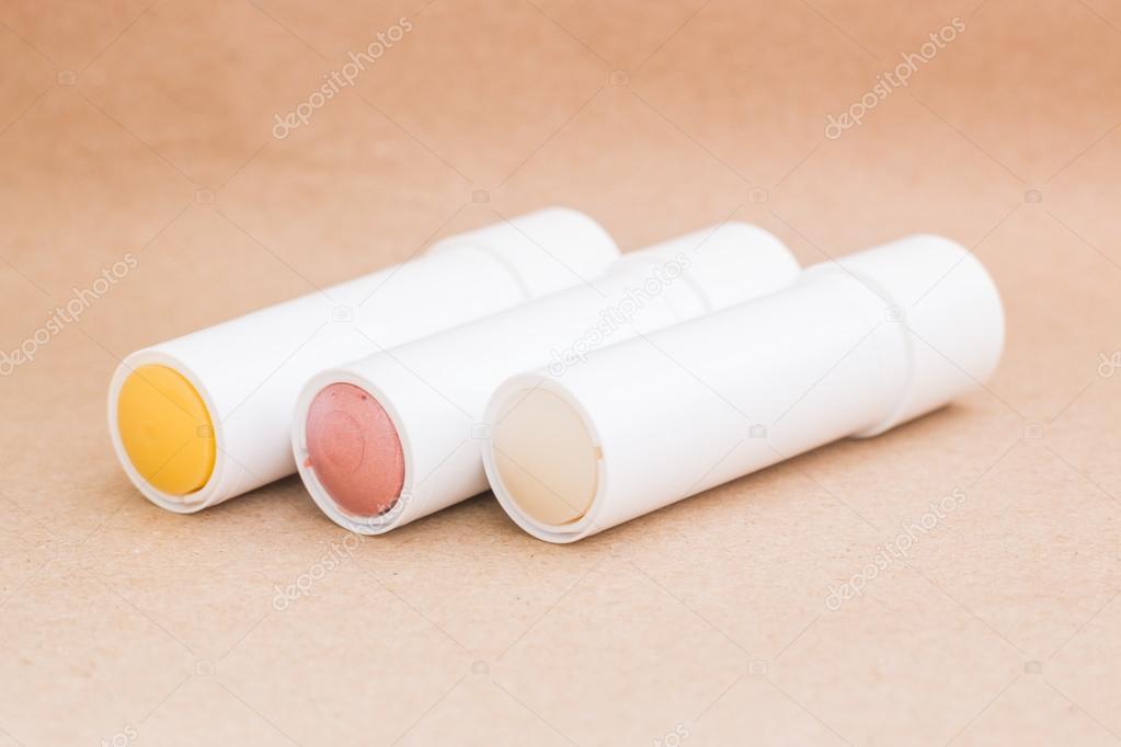 Moisturizer lipstick on brown natural background