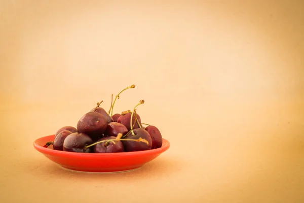 Group of cherries on warm vintage background — Stock Photo, Image
