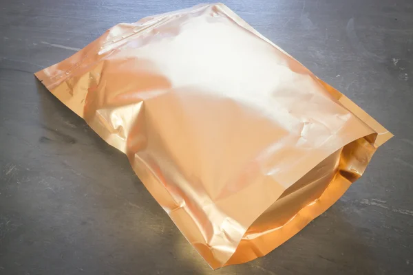 Golden aluminum bag of premium coffee bean — Stock Photo, Image
