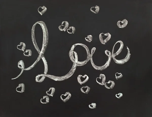 Message Love with small Hearts. Lettering on chalk board — Stok fotoğraf