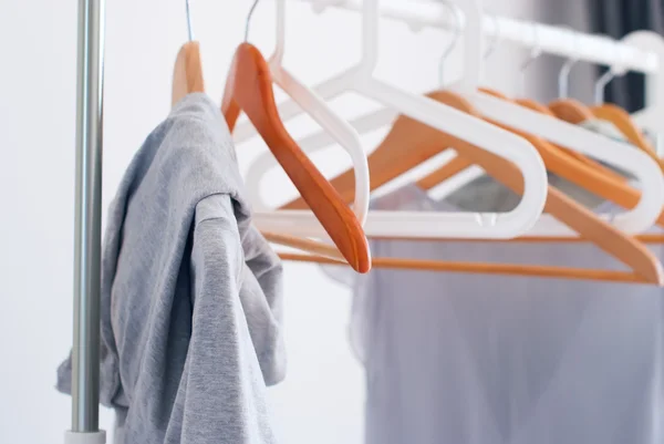 Wooden Plastic Hangers Pastel Grey Female Clothes — Stock Photo, Image