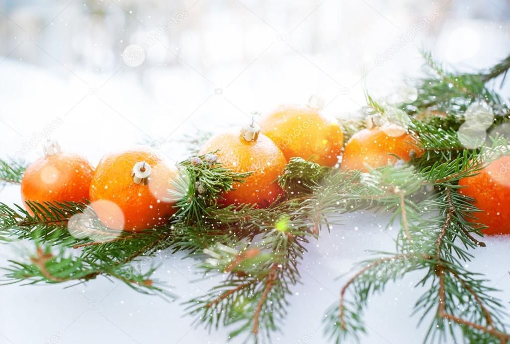 Greeting Card with Tangerines, boke and snowflakes