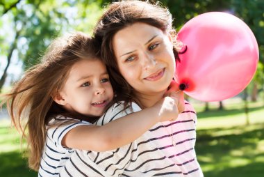 Mother and Daughter with Pink Balloon