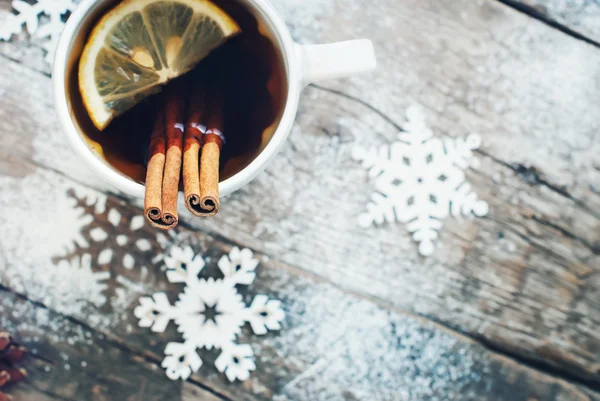 Cup of Tea with a Lemon and Cinnamon on Christmas Background — Stock Fotó