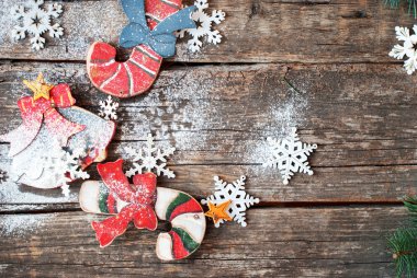 Vintage Wooden Fir Tree Toys Candy Canes, Bell and Snowflakes on Rustic Desks