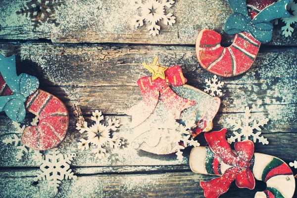 Festive Vintage Fir Tree Toys Candy Canes, Bell on Wooden Desk. Decorated with Snowflakes. Toned — Stock fotografie