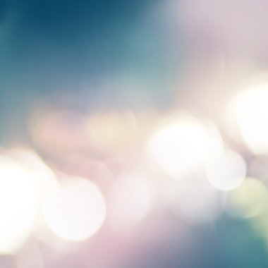 Işık harekete geçirilir ve renkli noktalar. Pastel renkler beyaz, mavi, pembe arka plan üzerinde