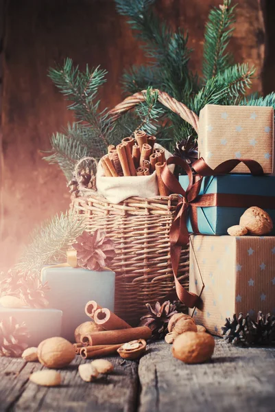 Christmas Natural Gifts with Boxes, Basket, food, Pine Cones, Wallnuts. Toned — Stockfoto