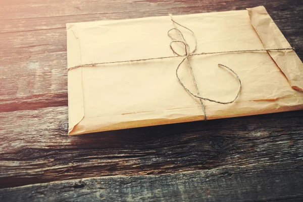 Vintage Envelope on a Wooden Background. Toned — Stock fotografie