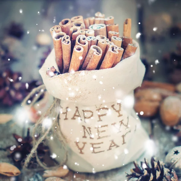 Linen Bag with Embroidery Happy New Year and Sticks of Cinnamon. Snow effects Stock Obrázky