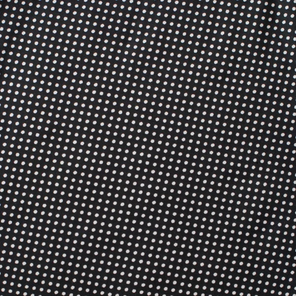 Cetim têxtil vintage com bolinhas brancas Padrão de pontos no fundo preto — Fotografia de Stock