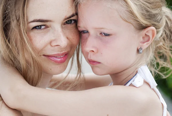 Hugging smiling mother and daughter. Family — Stock Photo, Image