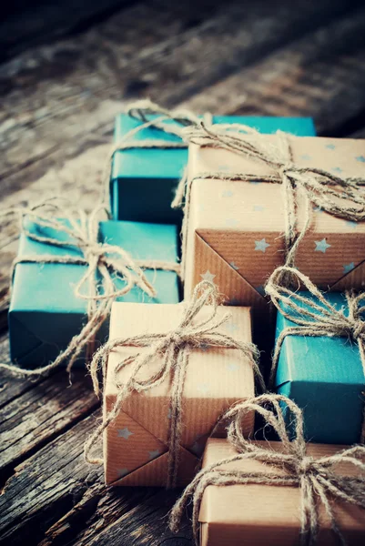 Festive Boxes with Cord. Color Gifts on Wooden Background — Stok fotoğraf