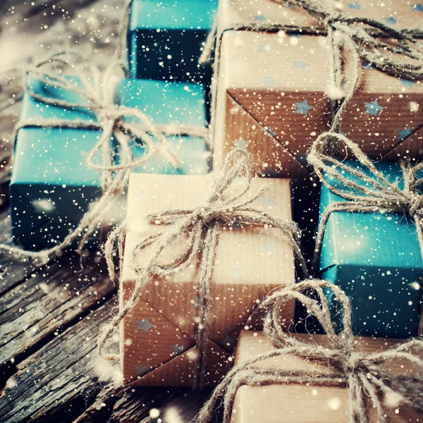 Festive Boxes with Linen Cord. Drawn Snowfall. Toned — Stok fotoğraf