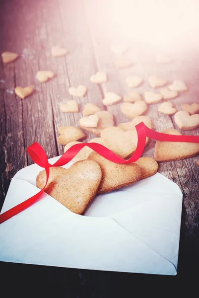 Cookies in the Shape of Heart from Letter with Red Ribbon — Stok fotoğraf