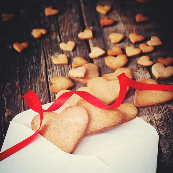 Cookies in the Shape of Heart from Letter. Toned — Stok fotoğraf