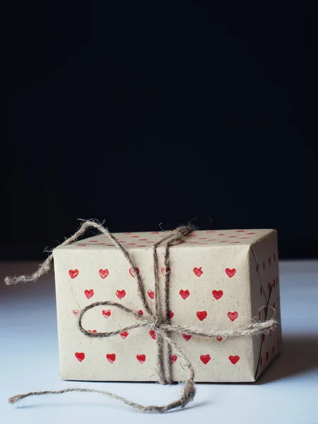 Present in Handmade Paper with Red Little Hearts Pattern — Stok fotoğraf