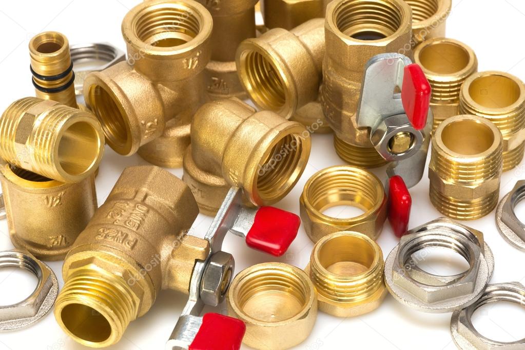 Brass fittings for plumbing pipes Stock Photo by ©Leonid_Shtandel 102083612