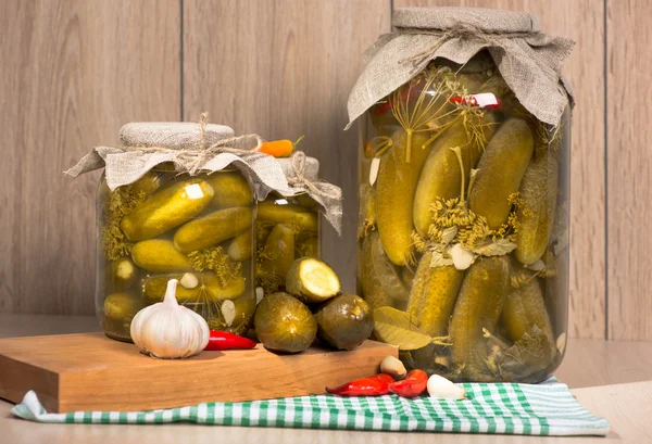 Pickled gherkins in glass jars — Stock Photo, Image