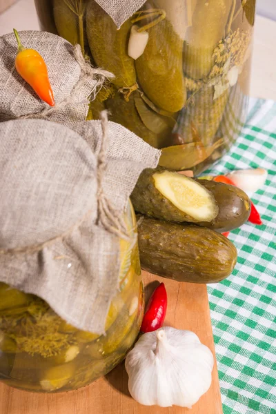 pickled gherkins in glass jars