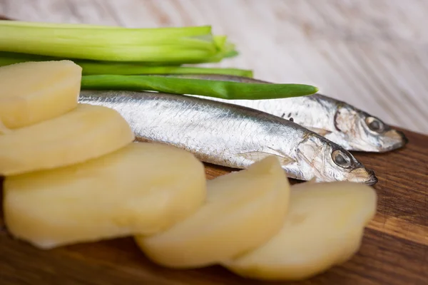Spicy salted anchovies, onions and boiled potatoes — Stock Image Spicy salted anchovies, onions and boiled potatoes Stock Photo