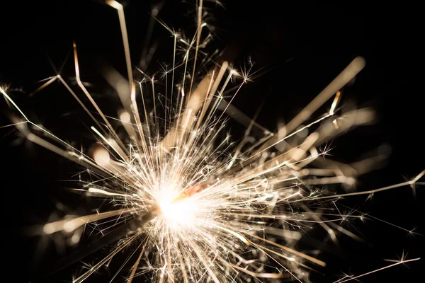 Sparkler or Bengal fire - scattering sparks Royalty Free Stock Images