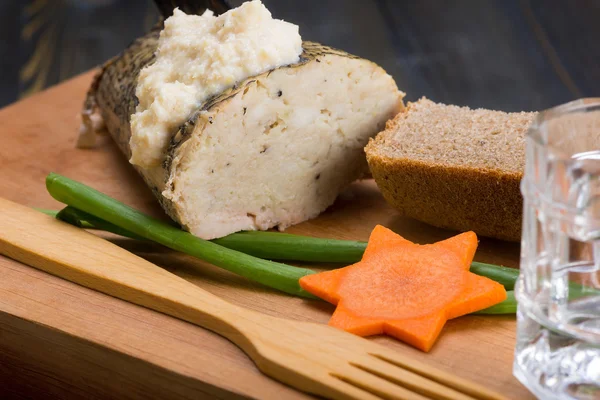 A traditional Jewish dinner, stuffed pike and black bread — Stock Image A traditional Jewish dinner, stuffed pike and black bread Royalty Free Stock Photos