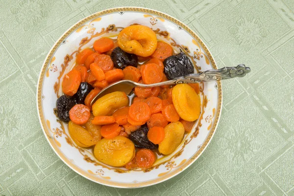 Tzimmes, tsimmes, stewed sweet carrots with dried fruit — Stock Photo, Image