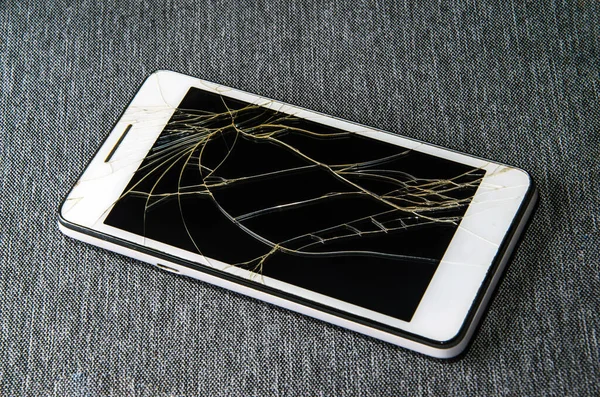 Crack on the glass. Broken screen. Broken phone. Cracked glass background.