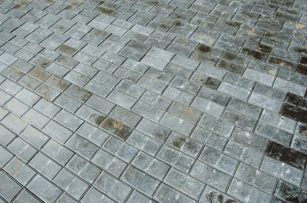 Abstract background of old cobblestone pavement close-up. — Stock Photo, Image